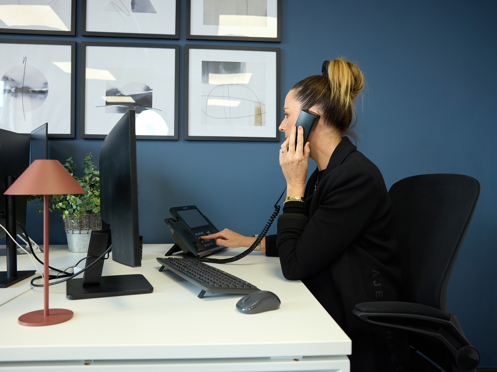 Employee on VOIP telephone